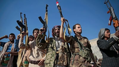 Tribesmen loyal to Houthi rebels hold up their weapons as they attend a gathering in Sanaa. AP