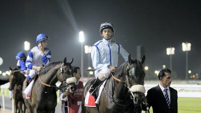 Jockey Royston French makes his way to the dirt track on Sheikh Hamdan bin Mohammed's horse, Rockley, for the Emirates Skywards Handicap 1,600m race at Meydan. Reem Mohammed / The National