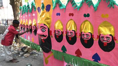 An artisan gives final touches to the effigy of Ravana in Amritsar. AFP