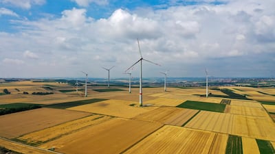 The Covid-19 pandemic has accelerated the green transition in economies. Wind turbines stand near the hydrogen electrolysis plant stands at Energiepark Mainz, operated by Linde, in Mainz, Germany. Bloomberg
