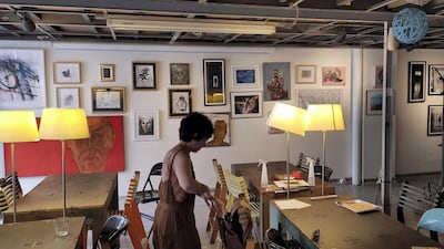 Two cats and a dozen kittens sprawl on the wooden tables beside mismatched lamps, and the walls are covered with artworks that change every few weeks in a cycle of temporary exhibitions. Courtesy Omar Berakdar