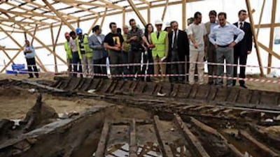 The Turkish minister of culture and tourism, Ertugrul Gunay, examines the excavation work and archaeological finds at the site of the Marmaray project in Yenikapi, Istanbul.