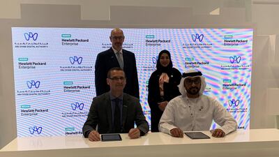 (sitting from L) Wolfgang Egger, vice president and managing director of HPE Middle East and South Africa, and Abdulla Al Kendi, executive director, technology and policies at ADDA, during the pact signing on Tuesday. Courtesy ADDA