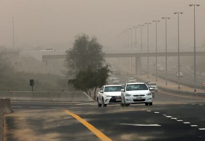 A sandstorm reduces visibility across Dubai. Satish Kumar / The National