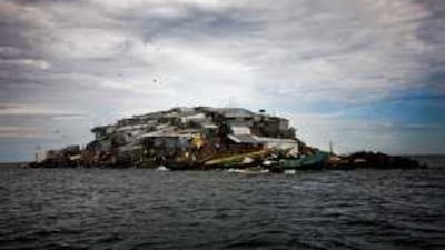 Shiny corrugated shacks cover Migingo Island like the scales of a Lake Victoria perch.