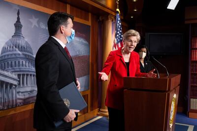 US Senator Elizabeth Warren, centre, is pushing for a wealth tax targeting millionaires. EPA