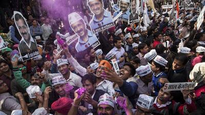 Supporters of the Aam Aadmi Party, or Common Man’s Party, celebrate their party’s victory in New Delhi on February 10, 2015. Tsering Topgyal/AP Photo