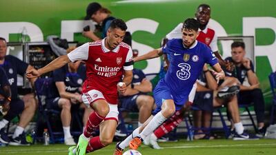 Arsenal forward Gabriel Martinelli moves the ball past Chelsea midfielder Jorginho. AP