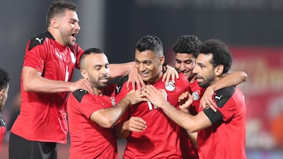 Egypt players celebrate with Mostafa Mohamed after his goal againt Guinea in the Africa Cup of Nations qualification match in Cairo. EPA