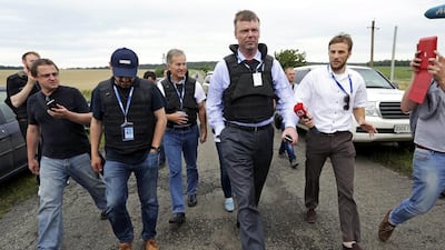 Inspectors arrive for investigations at the crash site of Boeing 777, Malaysia Airlines flight MH17 airplane, which crashed during flying over the eastern Ukraine region near Donetsk, Ukraine. EPA/ANASTASIA VLASOVA