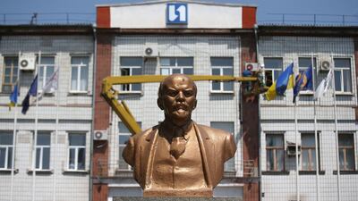 A bust of Vladimir Lenin stands in front of Metinvest IIyich Iron and Steel Works in Mariupol. John Moore / Getty Images