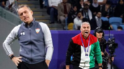 Palestine manager Makram Daboub shouts inctructions as his UAE counterpart Paulo Bento looks on. Reuters