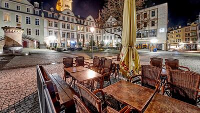 The otherwise busy Am Plan market square in Koblenz's old town is deserted in Koblenz, Germany. Due to the coronavirus pandemic, there is a general curfew in Koblenz in the evenings from 10 p.m. AP