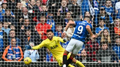 German striker Antonio Colak (R) shoots past Tottenham goalkeeper Hugo Lloris to give Rangers the lead. AFP
