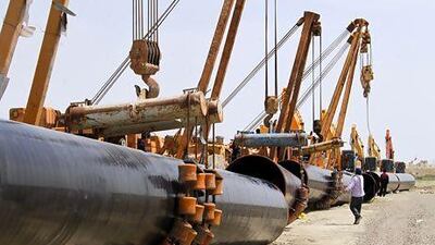 Iranians work on a section of the gas pipeline linking Iran and Pakistan. Iran has already completed 900km of pipeline on its side of the border. Atta Kenare / AFP