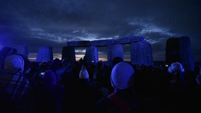 Revellers celebrate the summer solstice at the Stonehenge in England. Neil Munns / EPA