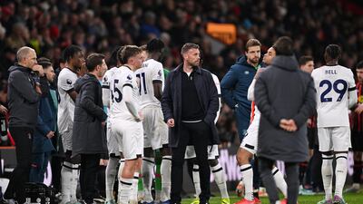 Luton Town players wait as Tom Lockyer receives medical attention at the Vitality Stadium on Saturday, December 16, 2023. Getty Images