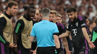 Bayern manager Thomas Tuchel and players argue with the assistant referee after an offside decision denied Bayern a late goal. Getty Images
