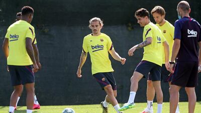 Antoine Griezmann and midfielder Ivan Rakitic during a training session at Joan Gamper Sports City. EPA