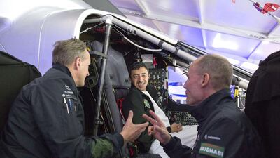 Sheikh Abdullah Bin Zayed Al Nahyan (centre), Minister for Foreign Affairs of the UAE, listening to the president of the Swiss sun-powered aircraft Solar Impulse project, Bertrand Piccard (right) and pilot Andre Borschber (left) during a tour of the plane. AFP / WAM
