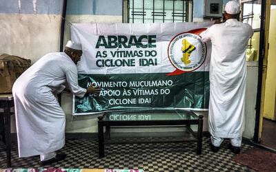 Volunteers of the Muslim movement to support the victims of Cyclone Idai put up a banner at their community centre in Maputo, Mozambique, March 23, 2019. Jack Moore / The National