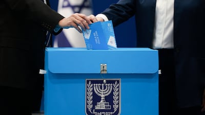 Israeli President Isaac Herzog and his wife Michal Herzog vote at a polling station during Israel's national election, in Jerusalem, October 27, 2026. REUTERS / Ronen Zvulun