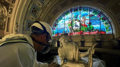 Specialists restore the 35-metre long, 26-metre wide ceiling of St George's Hall, Liverpool, on Monday. It is the first work on the ceiling in 70 years. PA