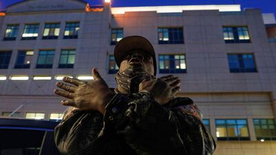 A fan takes part in a vigil for musician and actor DMX outside White Plains Hospital. Reuters
