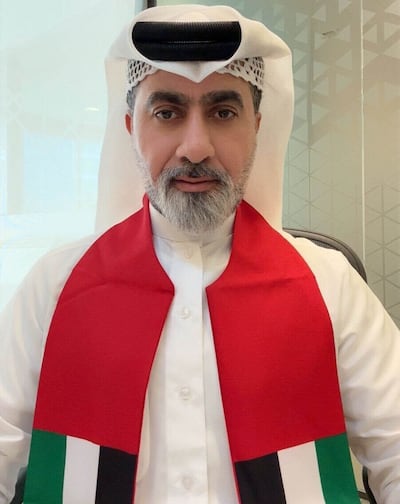 Football fan Bader Mohammed draped in the Emirati flag. Photo: Bader Mohammed