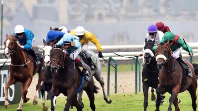 Almanzor, ridden by French jockey Jean-Bernard Eyquem, centre, crosses the finish line ahead of Zarak ridden by French jockey Christophe Soumillon, during the French Derby in Chantilly, north of Paris. Alain Jocard / AFP