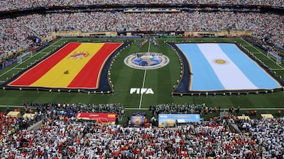 Teams enter the pitch for the national anthems ahead of the final. EPA