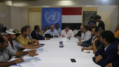 Lieutenant-General Michael Lollesgaard (C), head of the UN's redeployment coordination committee, chairs the meeting between representatives of Houthi rebels (R) and the Yemeni government (L) on board a UN ship off the port city of Hodeidah, Yemen, 15 July 2019. EPA