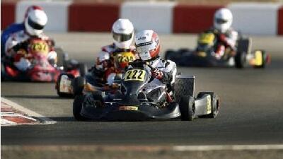 Racers gathered at Al Ain Raceway on Friday, October 1, 2010, to participate in the UAE Rotax Max Challenge kart race. Mohammed al Dhaheri (222) leads the pack during the DD2 qualifying race.