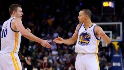 Stephen Curry, right, and David Lee are helping the Golden State Warriors thrive.