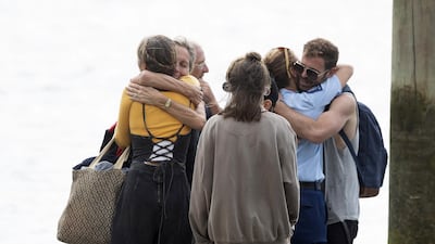 Family returns from the Frigate HMNZS Wellington where they observed a minutes silence near White Island in Whakatane, New Zealand. Getty Images