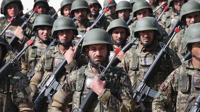 Soldiers with the Afghan National Army (ANA) graduate from basic training during a ceremony at the ANA’s combined fielding centre. Scott Olson / Getty / March 18, 2014