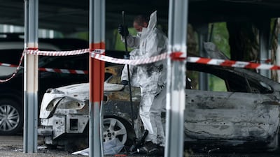 Police officers inspect one of the vehicles set on fire in the car park of Tarascon prison near Avignon, France. Reuters