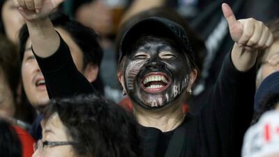 A All Blacks fan gestures ahead of the Rugby World Cup Pool B game at Oita Stadium between New Zealand and Canada in Oita, Japan. AP Photo