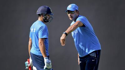 Indian cricket team director, Ravi Shastri, right, explains a point to Indian player Rohit Sharma during a practice session in Nagpur, India, Monday, March 14, 2016. (AP Photo/Saurabh Das)