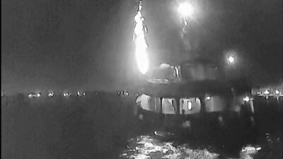 In this image made from video, one of the vessels is hit by an object on Tuesday while docked in Tunisia. AP
