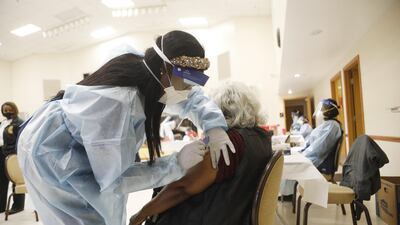 A healthcare worker administers the Covid-19 vaccine to residents living in the Jackson Heights neighbourhood at St Johns Missionary Baptist Church in Tampa, Florida. AFP