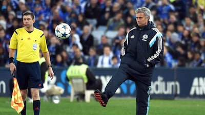 Chelsea coach Jose Mourinho (R) kicks the ball to a Sydney FC player during their football friendly match in Sydney on June 2, 2015. AFP PHOTO/William West