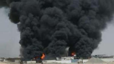This handout picture shows a fire at an oil depot in the Sajja area of Sharjah.