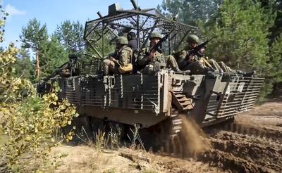 Soldiers in an armoured vehicle during the Zapad 2025 joint military drills in Belarus. EPA
