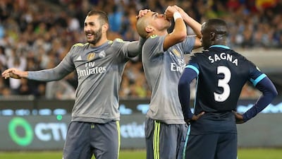 Pepe of Real Madrid celebrates his goal, with teammate Karim Benzema, the third for his side in a 4-1 win over Manchester City on Friday in a tour match in Australia. Quinn Rooney / Getty Images