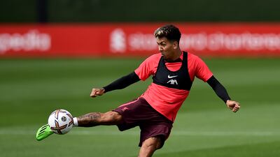 Liverpool attacker Roberto Firmino shoots during training.