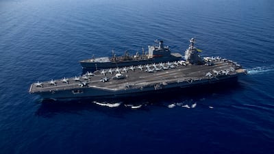The USS Gerald R Ford sails alongside a refuelling tanker in the Mediterranean. US Naval Forces Central Command / US 6th Fleet / Reuters