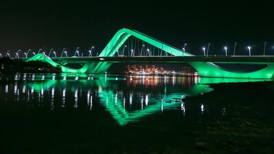 Sheikh Zayed Bridge is lit up in green to coincide with Abu Dhabi Sustainability week. Courtesy General Secretariat of the Executive Council