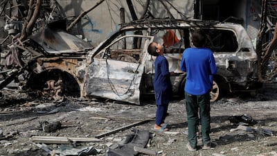 Afghan boys look the site of Sunday's attack in Kabul, Afghanistan July 29, 2019. Reuters