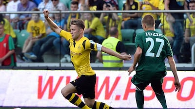 Jakub Blaszczykowski, left, pictured during a friendly against Slask Wroclaw on August 6, 2014, returned to Borussia Dortmund's line-up in the Uefa Champions League match against Anderlecht on December 9. Maciej Kulczynski / EPA